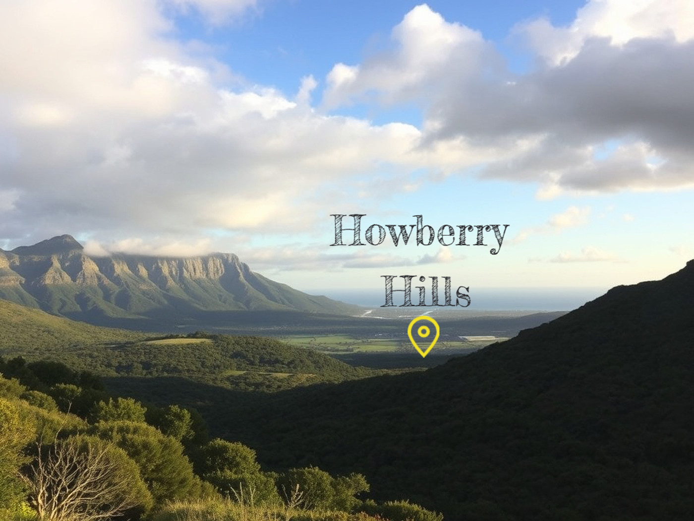 A breathtaking view of the Bitou valley at Howberry Hills, where lush greenery meets the mountain landscape